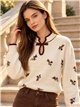 Pull brodé de fleurs avec nœud