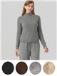Conjunto chaqueta de punto cuello alto y pantalón