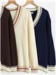 Jersey de punto cuello pico ribeteado