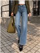 Calça jeans vintage de perna larga com faixa
