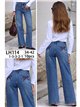 Jeans wide leg con lazos bordados