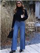 Calça jeans de perna larga com costura frontal contrastante.