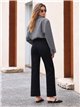 Jeans wide leg negro con bolsillos de plastrón