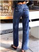 Jeans wide leg con faja y bolsillos con solapa