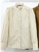 Blusa rayas con cuello volante