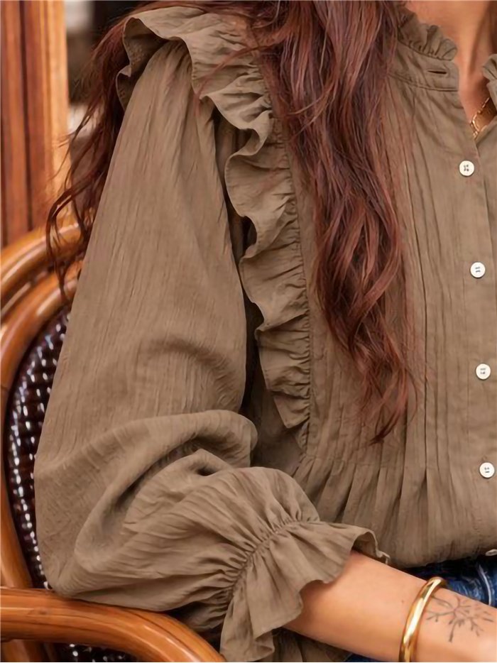 Blusa con volantes y pliegues