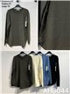 Pull à poches et boutons latéraux