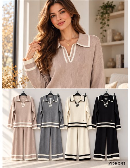 Completo composto da maglione a collo alto a coste e pantaloni a gamba larga.
