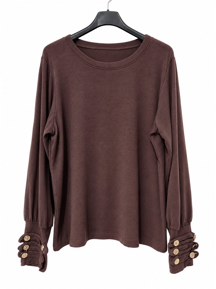 T-shirt con bottoni e polsini