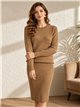 Conjunto jersey de punto trenzado y vestido tirante