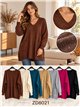 Suéter oversized com decote em V, lantejoulas e bolsos.